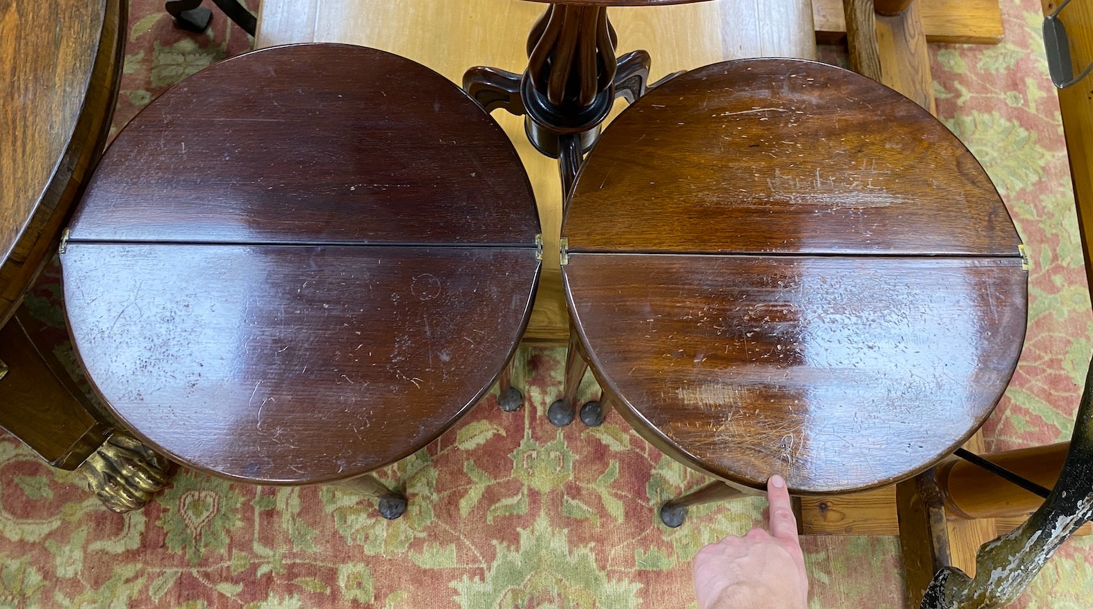 A near pair of small George II style red walnut D shaped folding tea tables, width 45cm, depth 22cm, height 74cm